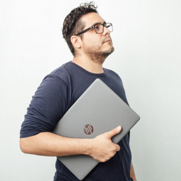 Man holding HP notebook